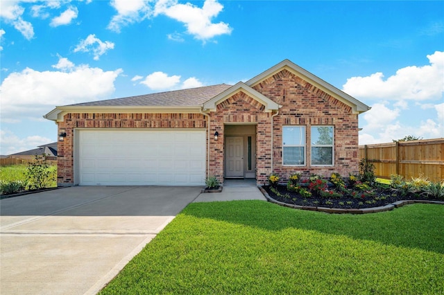 view of front of home featuring a garage and a front yard