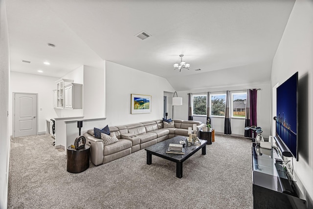 carpeted living room with a notable chandelier and lofted ceiling