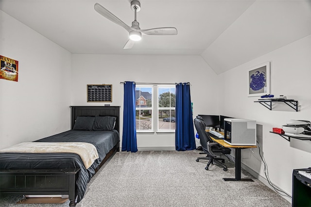 bedroom with ceiling fan, carpet flooring, and lofted ceiling