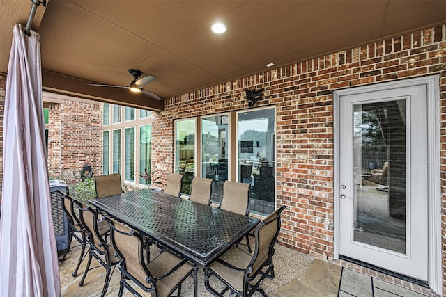 view of patio / terrace featuring ceiling fan