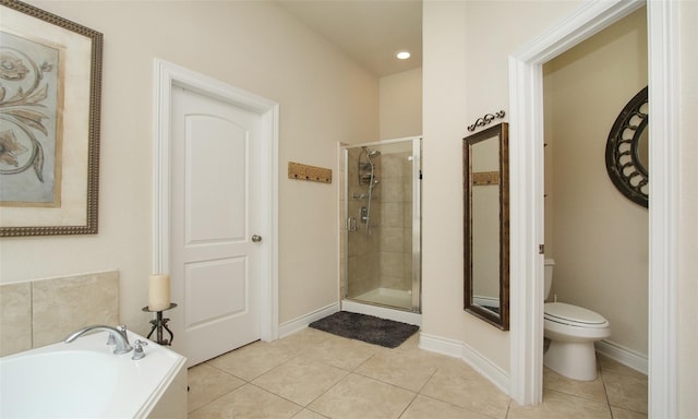 bathroom featuring toilet, tile patterned flooring, and plus walk in shower