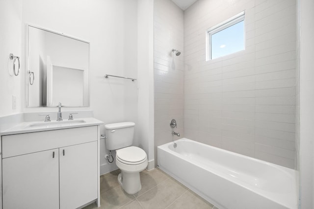 full bathroom featuring tile patterned floors, vanity, toilet, and tiled shower / bath combo