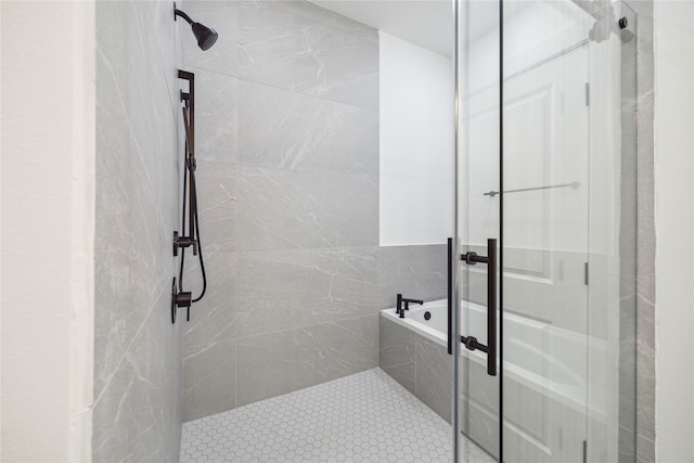 bathroom featuring separate shower and tub