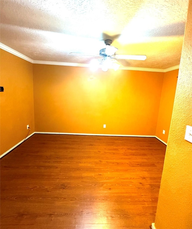 unfurnished room with hardwood / wood-style floors, a textured ceiling, ceiling fan, and ornamental molding