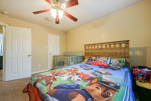 carpeted bedroom with ceiling fan