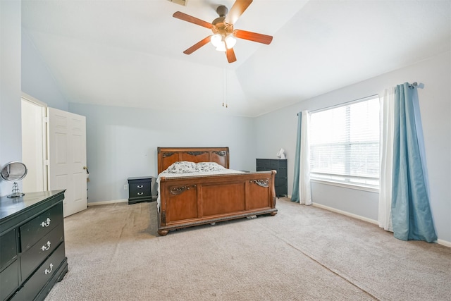 carpeted bedroom featuring ceiling fan and vaulted ceiling