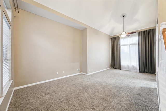 spare room with carpet floors and ceiling fan