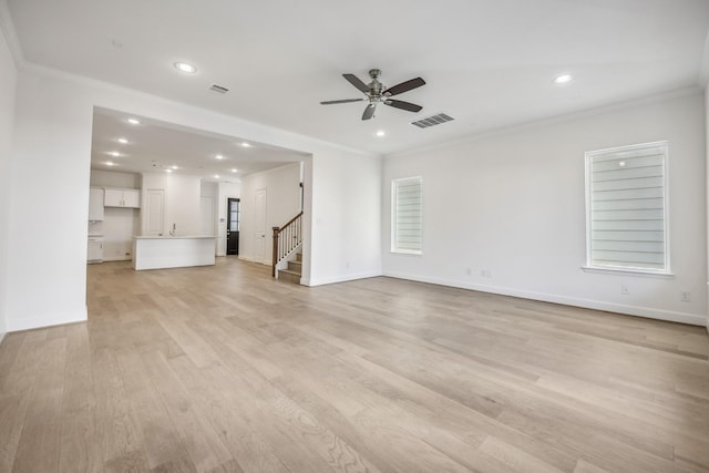 unfurnished living room with ceiling fan, light hardwood / wood-style flooring, and ornamental molding