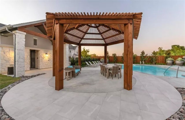 exterior space with a fenced in pool, outdoor dining space, a patio area, fence, and a pergola