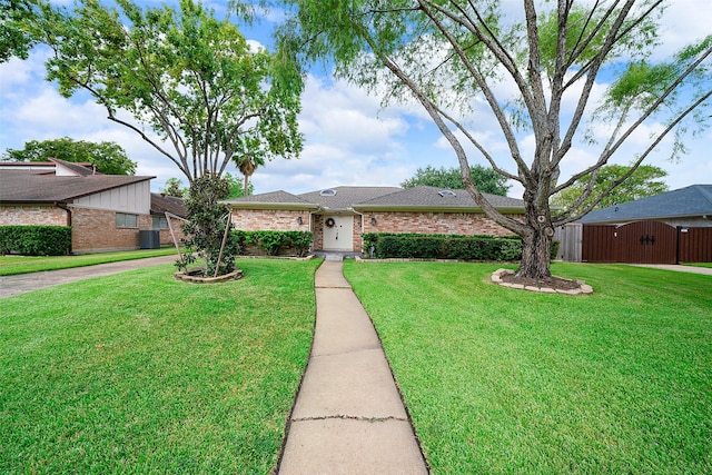 ranch-style house with a front lawn