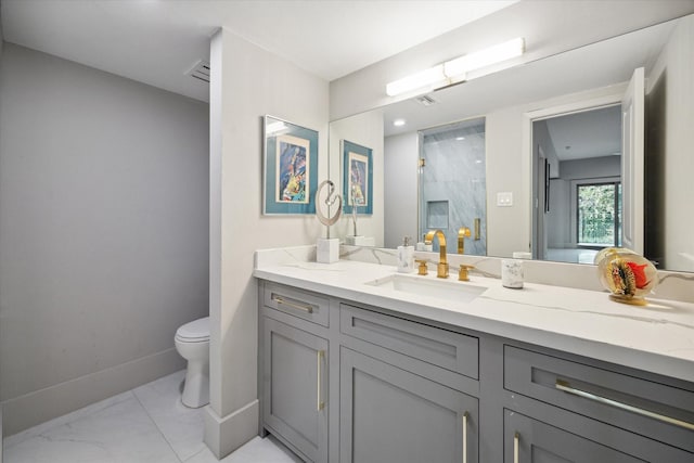 bathroom with a shower with shower door, toilet, and vanity