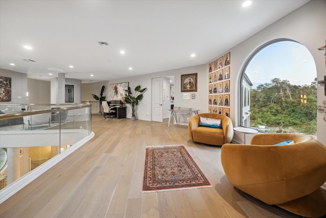 living room with light hardwood / wood-style flooring