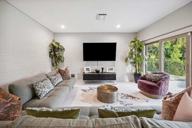 living room with brick wall