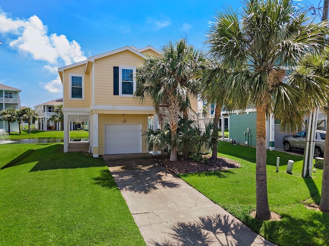 view of front of house with a garage and a front yard