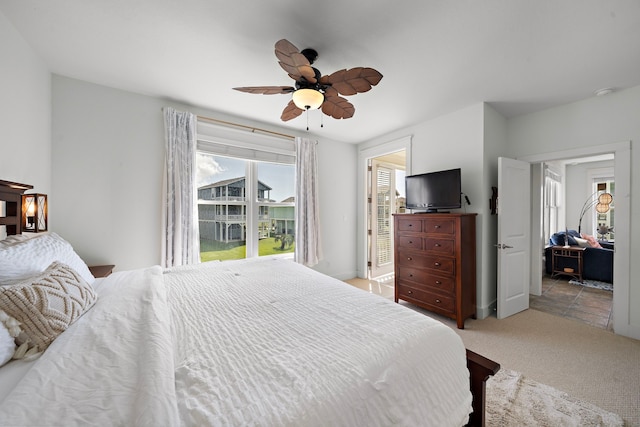 bedroom featuring ceiling fan and light carpet