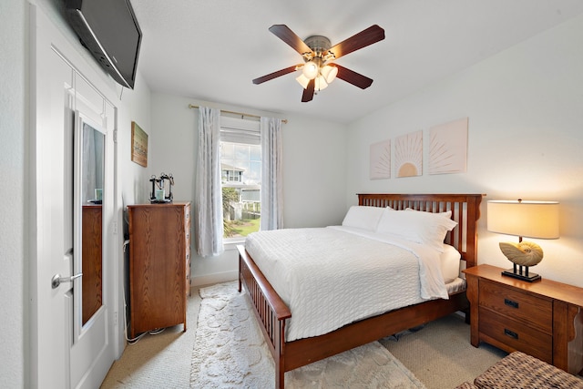 bedroom featuring ceiling fan and light colored carpet