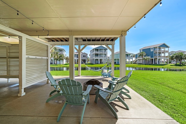 view of patio with a water view