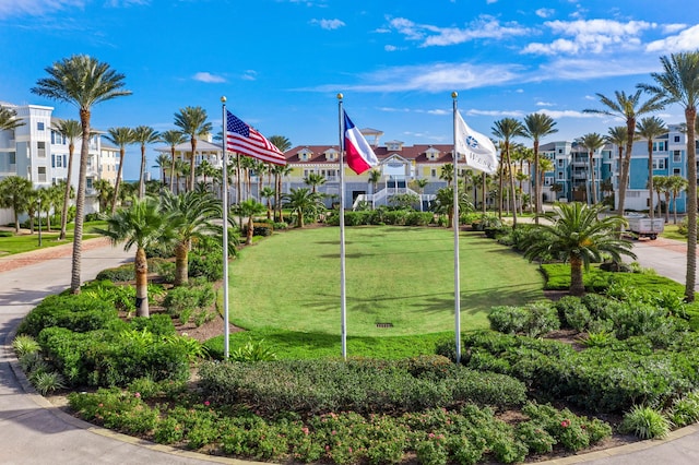 view of home's community featuring a lawn