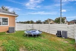 view of yard featuring central AC unit