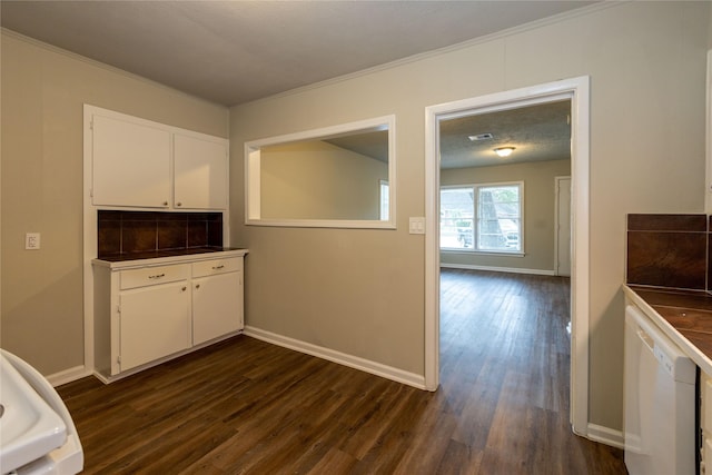 kitchen featuring crown molding, white dishwasher, tasteful backsplash, white cabinetry, and dark wood-type flooring