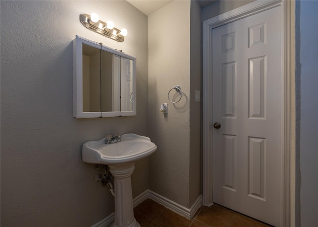 bathroom featuring tile patterned flooring