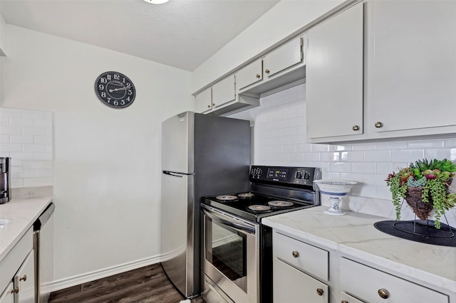 kitchen featuring backsplash, dark hardwood / wood-style floors, and stainless steel appliances