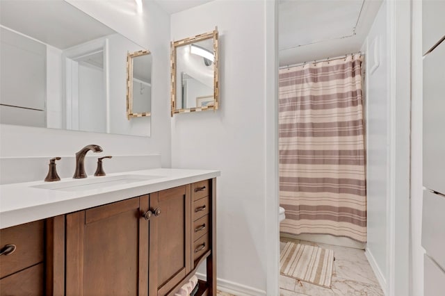 bathroom featuring walk in shower, vanity, and toilet