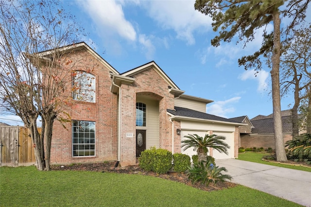 view of front of home with a garage and a front yard