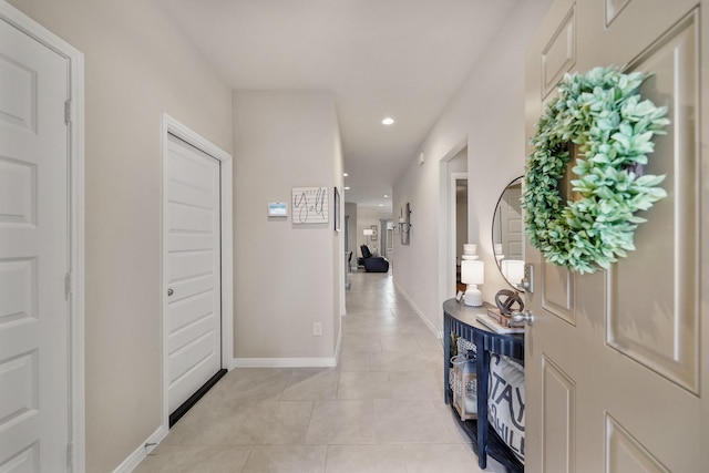 corridor featuring light tile patterned flooring