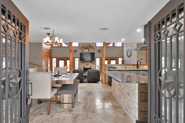 28540 Lynnwood Ln, Hempstead, TX 77445 - dining room featuring stone tile floors, a chandelier, and recessed lighting