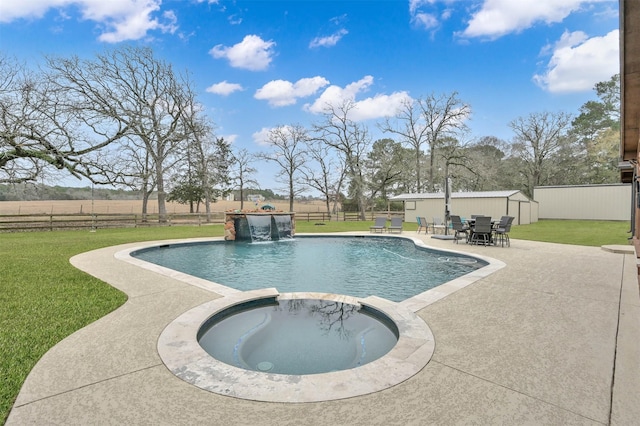 view of swimming pool with an in ground hot tub, pool water feature, a patio, and a lawn