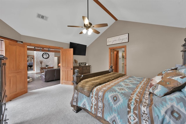 bedroom featuring high vaulted ceiling, a barn door, ceiling fan, and carpet flooring