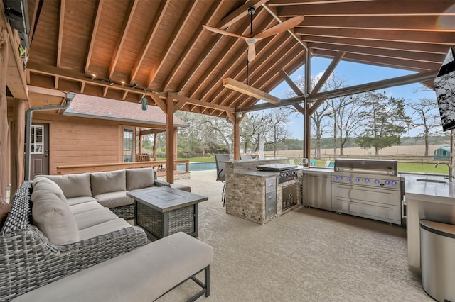 view of patio / terrace featuring sink, area for grilling, an outdoor hangout area, and ceiling fan