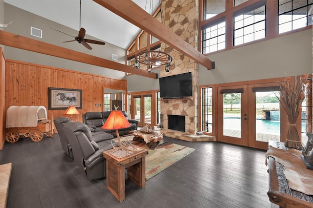 living room with french doors, a fireplace, dark hardwood / wood-style flooring, and ceiling fan