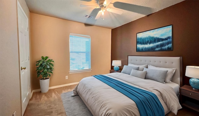 bedroom featuring ceiling fan and carpet flooring