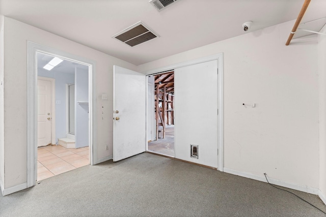 unfurnished room with light colored carpet