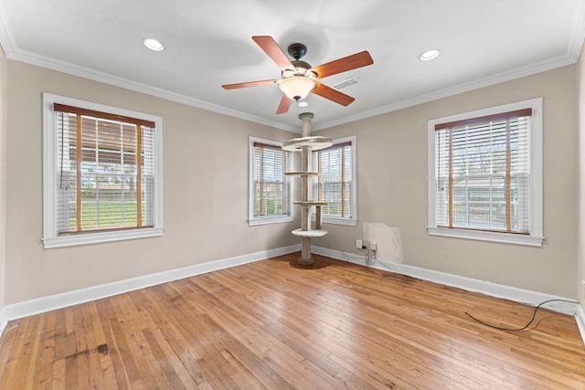 unfurnished room featuring crown molding, hardwood / wood-style flooring, and ceiling fan