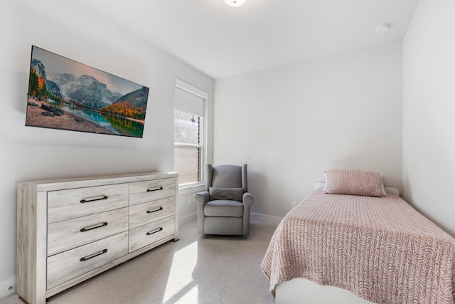 bedroom featuring light colored carpet