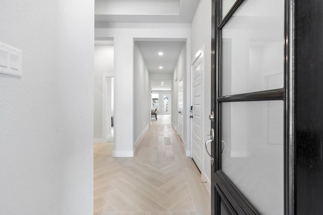 hall with light parquet floors