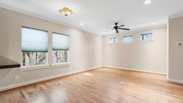 unfurnished room with crown molding, ceiling fan, and light wood-type flooring