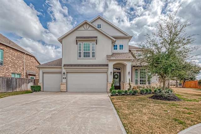 view of front of property featuring a garage and a front lawn