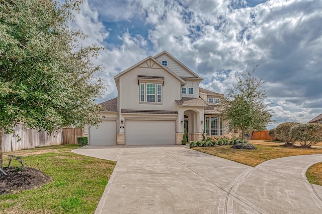 view of front of home with a garage and a front yard