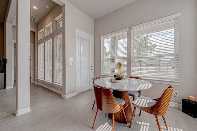 dining space featuring light hardwood / wood-style floors