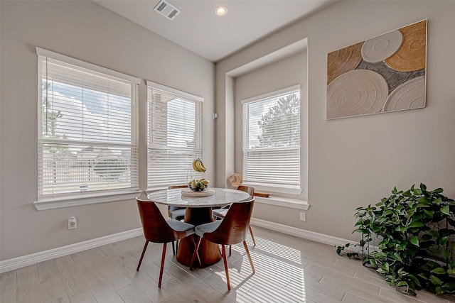 dining area featuring light wood-type flooring