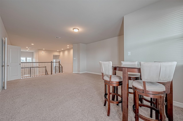 view of carpeted dining space