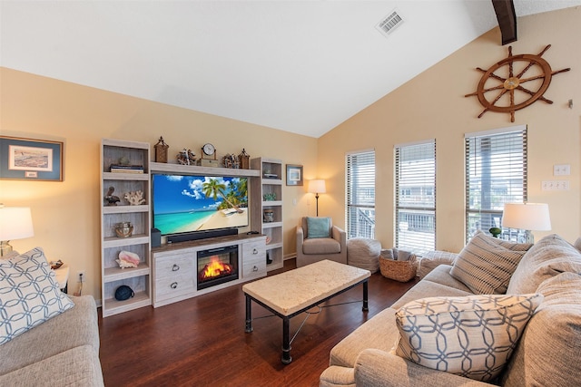 living room featuring vaulted ceiling with beams and dark hardwood / wood-style floors