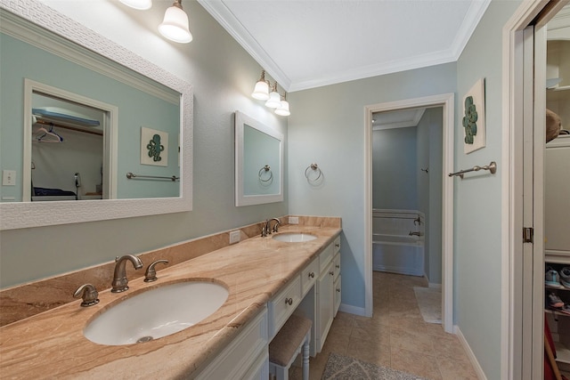 bathroom with vanity, ornamental molding, and tile patterned flooring