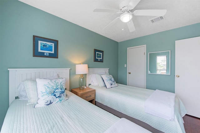 bedroom with wood-type flooring and ceiling fan