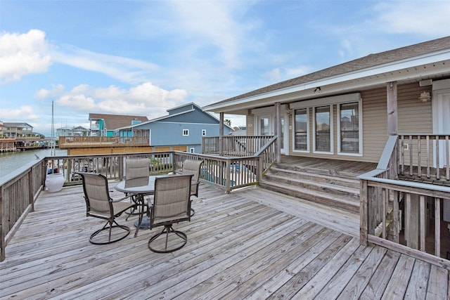 wooden deck featuring a water view