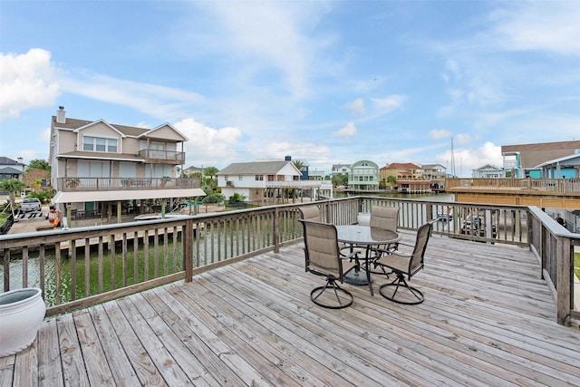 wooden deck with a water view